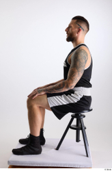 Whole Body Man White Sports Shorts Slim Athletic Sitting Top Studio photo references